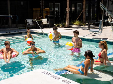 a group of college students in a swimming pool